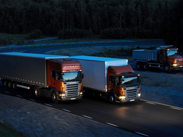 https://cargo.bold-themes.com/transport-company/wp-content/uploads/sites/2/2015/09/Three-orange-Scania-trucks-640x480.jpg